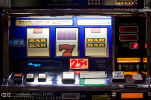 Slot machine with bars and 7s.