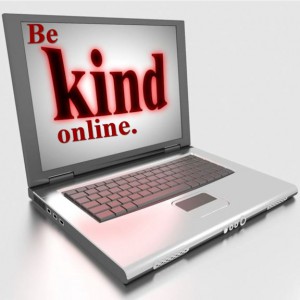 Word-art with image of computer screen saying "Be kind online."