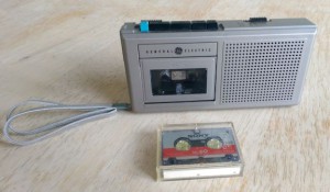 Mini tape recorder with cassette.