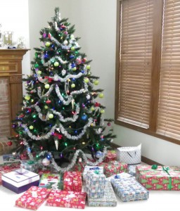 Christmas tree with presents all around.