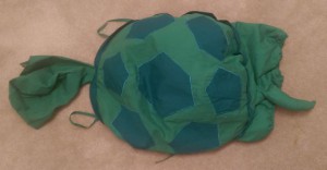 Child's green turtle costume.