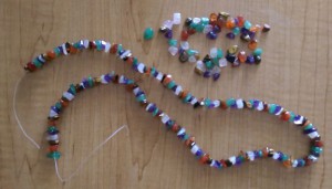 Necklace of crystal beads with a broken plastic string.