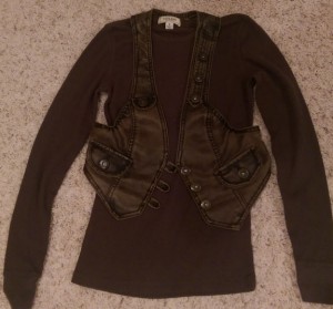 Greenish-brown long sleeved shirt with leather vest.