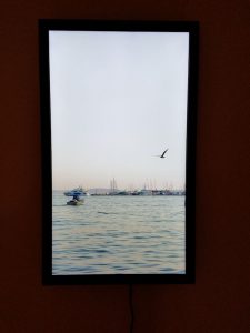 Seashore photo taken in Croatia as shown on a digital art display.