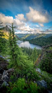 Photo of Lake Valhalla in Washington, with forested hills.