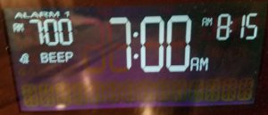 Alarm clock displaying 7:00 AM and "beep" indicator.