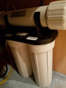 Reverse osmosis filter unit under the kitchen sink.