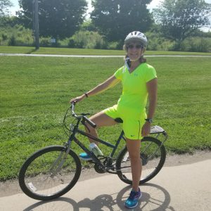 Photo of Meg Evans on an old Huffy bicycle