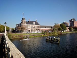 Sculler in front of the Royal Dutch Mint.