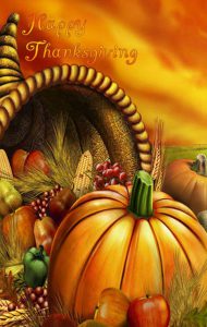 Happy Thanksgiving image with a pumpkin and horn of plenty.