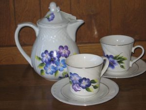 Tea set for two with floral pattern.