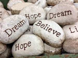 Word-art showing stones with words like "Dream" and "Hope."