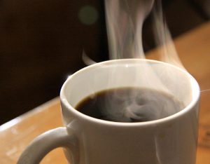 Photo of a coffee cup with steam rising from it.