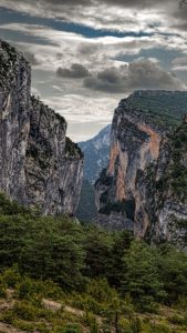 Mountain landscape with cloudy skies.