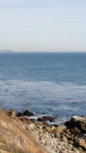 Rocky hill by a seashore.