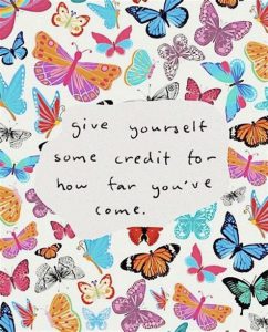 Word-art with butterflies that says "Give yourself some credit for how far you've come."