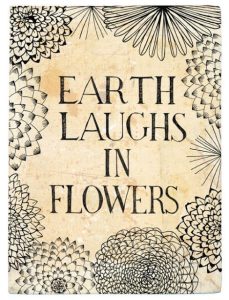 Word-art that says, "Earth laughs in flowers."