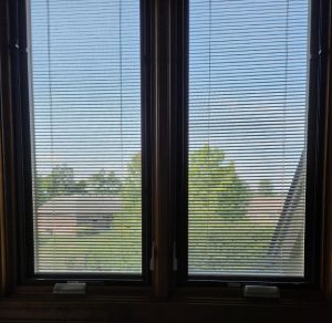 Photo of window with built-in blinds.