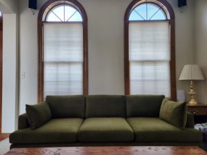 Photo of the new couch under my living room windows.