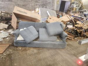 Photo of my old couch at the dump.