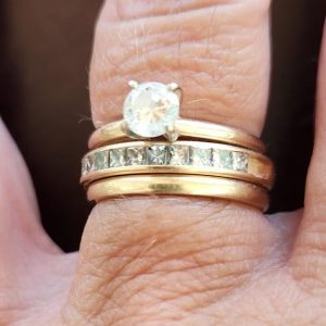 Photo of wedding, anniversary, and engagement rings.