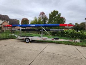 Photo of mini-trailer in my driveway with boats.