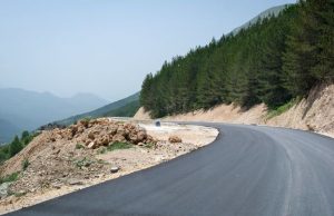 Photo of a mountain road with sharp curves.